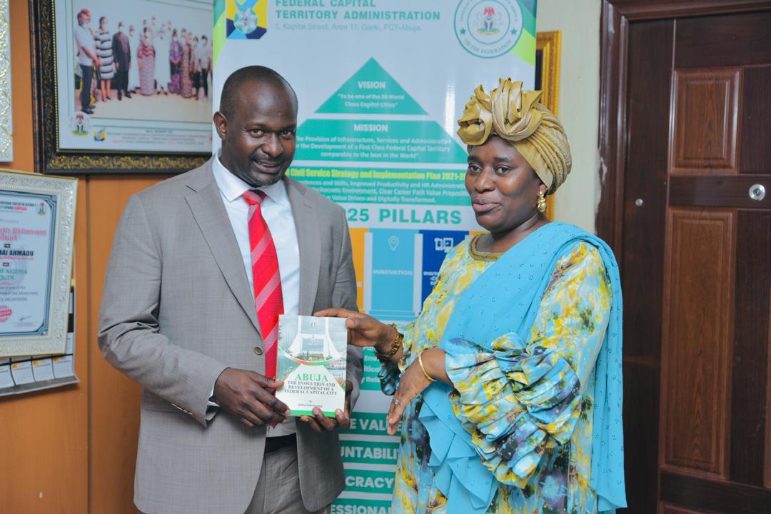 The Secretary General AAYC being awarded with a book by Dr. Jumail Ahmadu.