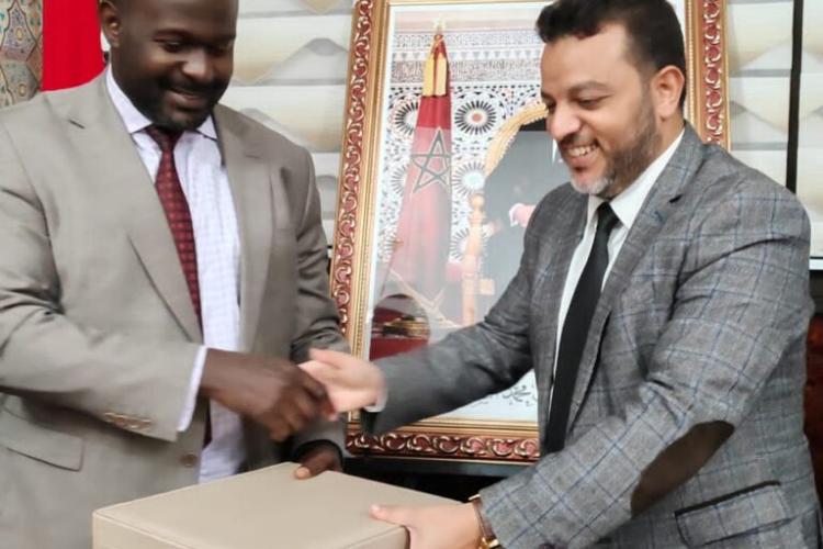 Hon Abbas Agaba Receiving a gift from Rabat mayor