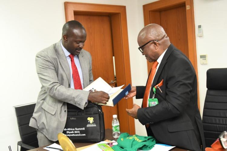  Dr. Atang Udo Samuel Head of the Civil Service of the Federal Capital Territory Authority receiving AAYC Souvenir from the Secretary General AAYC