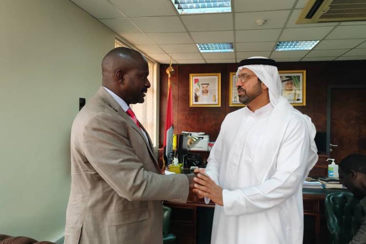 The SG gifting AAYC Magazine to the UAE Ambassador to Uganda