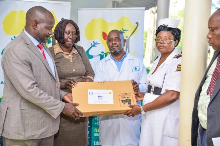 AAYC SG together with a representative from UNESCO/ICESCO handing over a laptop to Butabika mental Health institute